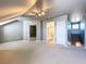 Carpeted bonus room with recessed lighting and access to bathroom, closet and stairs at 24314 Landing Dr, Lutz, FL 33559