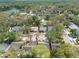 An overhead shot of a neighborhood with mature trees and multiple single Gathering homes at 2604 Shilo Ct, Valrico, FL 33596