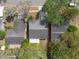 An overhead shot of a neighborhood with mature trees and multiple single Gathering homes at 2604 Shilo Ct, Valrico, FL 33596