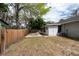 A view of the backyard featuring a screened in porch and partial view of the yard and fence at 2604 Shilo Ct, Valrico, FL 33596