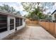 Backyard featuring a wooden fence, patio space, and connection to a sunroom at 2604 Shilo Ct, Valrico, FL 33596