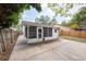 Backyard featuring a concrete patio, wooden fence, and a glimpse of the home's exterior at 2604 Shilo Ct, Valrico, FL 33596