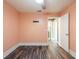 A view of a bedroom with a fan, baseboard, and views to other rooms in the home at 2604 Shilo Ct, Valrico, FL 33596