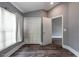 Bedroom with new floors, vaulted ceiling, and access to the closet and other rooms at 2604 Shilo Ct, Valrico, FL 33596