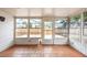 Inviting sunroom with tile flooring and multiple windows offering a view of the backyard at 2604 Shilo Ct, Valrico, FL 33596