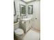 Bathroom with a vanity, decorative mirror, and tile backsplash at 2630 Pearce Dr # 104, Clearwater, FL 33764