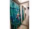 Bathroom with marine-themed shower curtain and mirrored door at 2630 Pearce Dr # 104, Clearwater, FL 33764
