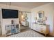 Bedroom featuring a mounted TV, mirrored closet, and neutral carpet at 2630 Pearce Dr # 104, Clearwater, FL 33764