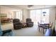 Spacious living area featuring comfortable seating and a dining table near large windows at 2630 Pearce Dr # 104, Clearwater, FL 33764