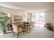 Spacious living room with traditional furnishings, neutral carpet, and access to outdoor patio at 2630 Pearce Dr # 104, Clearwater, FL 33764