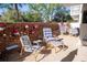 Cozy brick patio with striped seating, a dart board, and colorful plants at 2630 Pearce Dr # 104, Clearwater, FL 33764