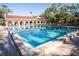 Outdoor pool surrounded by trees at 2630 Pearce Dr # 104, Clearwater, FL 33764