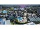 Aerial view of clubhouse with pool, tennis and pickleball courts surrounded by mature trees at 29909 Baywood Ln, Wesley Chapel, FL 33543