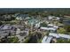 Aerial view of community with large pool, water feature, clubhouse, and lush landscaping at 29909 Baywood Ln, Wesley Chapel, FL 33543