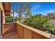 Balcony offering views of the golf course and blue skies framed by tall pine trees at 29909 Baywood Ln, Wesley Chapel, FL 33543