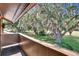 Balcony view with mature trees and lush landscaping, creating a serene outdoor space at 29909 Baywood Ln, Wesley Chapel, FL 33543