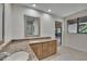 Bathroom showcasing dual sinks, granite countertops, and natural light through the window at 29909 Baywood Ln, Wesley Chapel, FL 33543