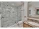 Renovated walk-in shower with elegant marble design and a sleek glass enclosure at 29909 Baywood Ln, Wesley Chapel, FL 33543