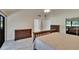 Bright and airy bedroom with wood furniture, vaulted ceiling, and neutral color palette at 29909 Baywood Ln, Wesley Chapel, FL 33543