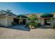 A bright and inviting clubhouse with lush landscaping and an awning-covered entryway for golf at 29909 Baywood Ln, Wesley Chapel, FL 33543