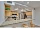 Bright kitchen with granite countertops, stainless steel appliances, and an open breakfast bar at 29909 Baywood Ln, Wesley Chapel, FL 33543