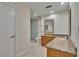 Bright bathroom featuring a frameless glass shower, granite countertop, and double sink vanity at 29909 Baywood Ln, Wesley Chapel, FL 33543