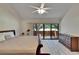 Bright main bedroom with natural light and sliding glass doors that opens to scenic outdoor views at 29909 Baywood Ln, Wesley Chapel, FL 33543
