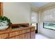 Bonus room with wood countertops and built-in grill, illuminated by natural light from shaded windows at 3310 Tanglewood Trl, Palm Harbor, FL 34685