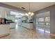Bright kitchen featuring white cabinets, tile floors, and an open layout with lots of natural light at 3310 Tanglewood Trl, Palm Harbor, FL 34685