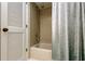 Shower featuring beige square tiles and a white bathtub at 3310 Tanglewood Trl, Palm Harbor, FL 34685