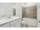 Bathroom featuring a bath/shower combination with decorative tile surround at 4275 Big Sky Dr, Spring Hill, FL 34604
