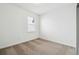 Bright bedroom featuring a window and neutral carpet flooring at 4275 Big Sky Dr, Spring Hill, FL 34604