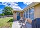 Cozy back patio with a table and chairs, ideal for relaxing and enjoying the serene outdoor space at 4503 Lace Cascade Ct, Lutz, FL 33558
