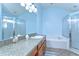 Light and airy bathroom featuring a garden tub, separate shower, and vanity with sink at 4503 Lace Cascade Ct, Lutz, FL 33558