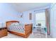Cozy bedroom with a light blue color scheme, a writing desk, and a ceiling fan at 4503 Lace Cascade Ct, Lutz, FL 33558