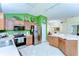 Spacious kitchen with a large stainless refrigerator, modern appliances, and natural light at 4503 Lace Cascade Ct, Lutz, FL 33558