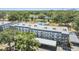 Beautiful aerial view of condo complex with a community pool and well-maintained grounds at 4801 Airport Rd # 214, Zephyrhills, FL 33542