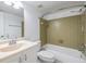 Bathroom with tub/shower combination with a light tiled surround and updated vanity at 4801 Airport Rd # 214, Zephyrhills, FL 33542