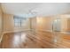 Bright living room featuring hardwood floors, a ceiling fan, and a window with valances at 4801 Airport Rd # 214, Zephyrhills, FL 33542