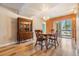 Cozy dining room features hardwood floors, a crystal chandelier, and a wooden china cabinet at 4801 Airport Rd # 214, Zephyrhills, FL 33542