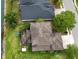 Aerial view of a home with a screened-in patio overlooking a lake at 4810 Diamonds Palm Loop, Wesley Chapel, FL 33543