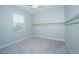 Clean and bright bedroom with neutral tones and a ceiling fan, providing a comfortable living space at 4810 Diamonds Palm Loop, Wesley Chapel, FL 33543