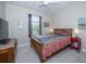 Charming bedroom features a window view, carpeted floors, colorful bedding, and ample natural light at 4810 Diamonds Palm Loop, Wesley Chapel, FL 33543