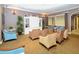 Cozy seating area in a community clubhouse, featuring comfortable chairs and decor at 4810 Diamonds Palm Loop, Wesley Chapel, FL 33543