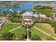 Aerial view showing the community, building, and expansive landscaping with the lake in the background at 525 Manns Harbor Dr, Apollo Beach, FL 33572