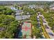 Aerial view of the community featuring tennis courts, a basketball court, and a scenic walking path at 525 Manns Harbor Dr, Apollo Beach, FL 33572