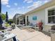Charming backyard with patio, seating, grill, and screened-in porch visible at 525 Manns Harbor Dr, Apollo Beach, FL 33572