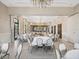 Spacious ballroom with elegant chandeliers, neutral tones, and ample seating arrangements at 525 Manns Harbor Dr, Apollo Beach, FL 33572