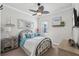 Cozy bedroom with neutral tones, featuring a comfortable bed, dresser, and stylish decor accents at 525 Manns Harbor Dr, Apollo Beach, FL 33572