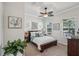 Inviting bedroom featuring a comfortable bed, stylish decor, and natural light from the windows at 525 Manns Harbor Dr, Apollo Beach, FL 33572
